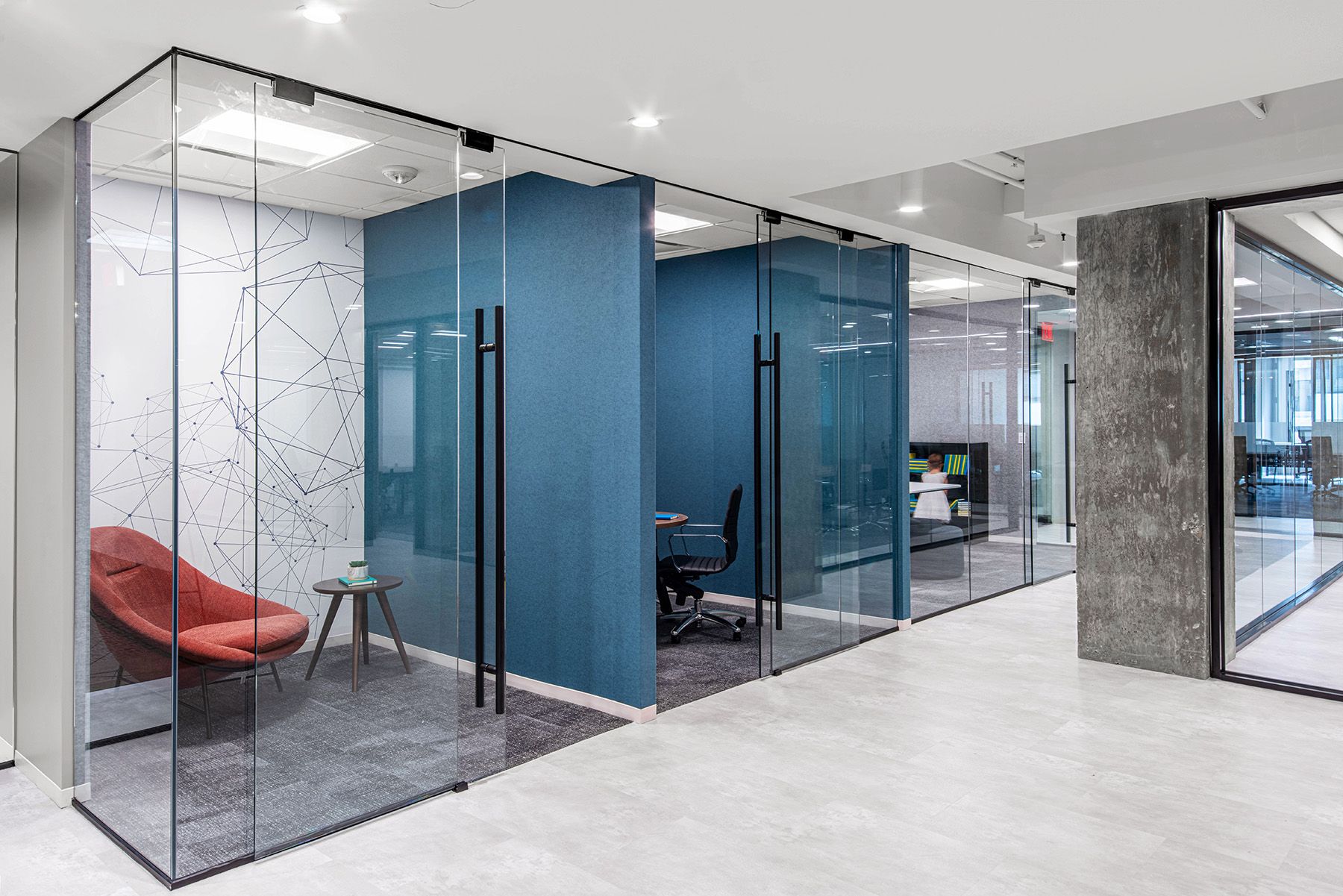 The 2000 M Street Speculative Suites in Washington, DC, uses cylinder lights and troffers to create a bright environment designed to attract talent.