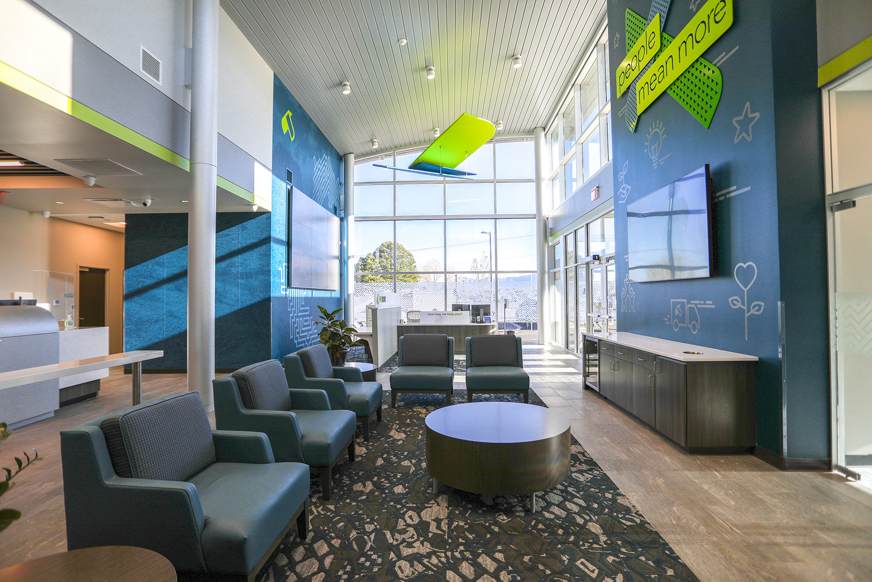 Cylinder LED downlights illuminate a suspended brand eagle in the lobby of a U.S. Eagle Federal Credit Union branch in Albuquerque, New Mexico.